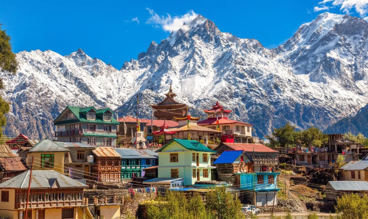 Beautiful landscape of Himachal Pradesh featuring snow-capped mountains, green valleys, pine forests, and scenic hill station views.