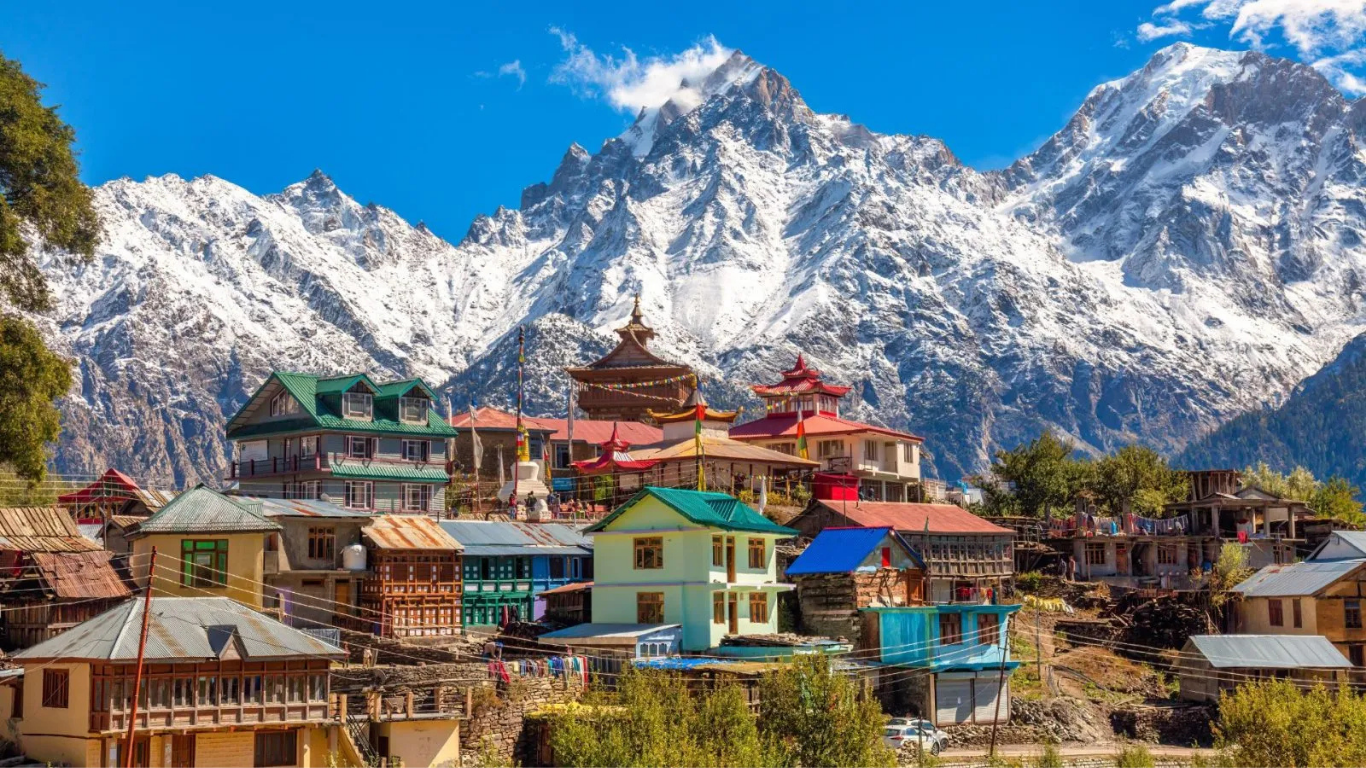Beautiful landscape of Himachal Pradesh featuring snow-capped mountains, green valleys, pine forests, and scenic hill station views.