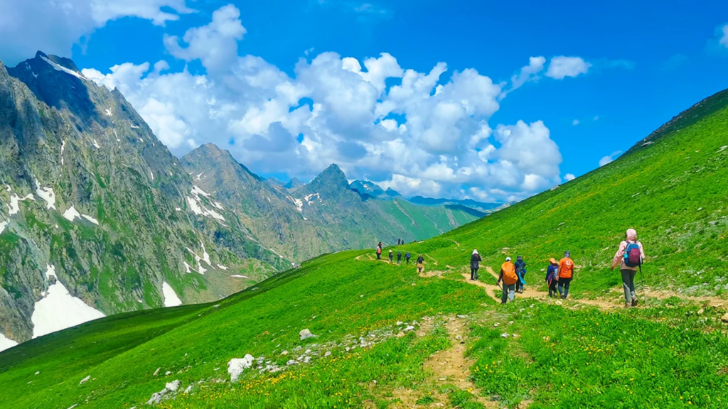 Crystal-clear alpine lakes and green meadows on the Tarsar Marsar Trek in Kashmir