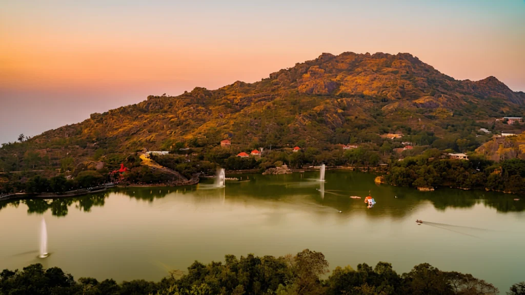 Nakki Lake and green hills in Mount Abu, Rajasthan during the monsoon season.