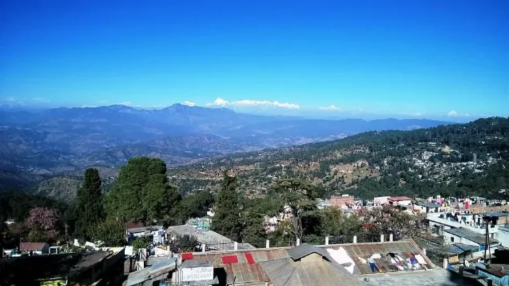Green meadows and Himalayan mountain views in Ranikhet, Uttarakhand.
